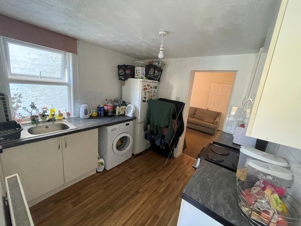 Lot: 119 - BAY-FRONTED HOUSE FOR INVESTMENT - Kitchen with fitted units and access to dining room